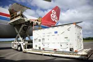 One of the two Galileo satellites 25 and 26 being unloaded from their Boeing 747 cargo jet at Cayenne – Félix Eboué Airport in French Guiana on 1 June 2018. The satellites travel inside protective air-conditioned containers.